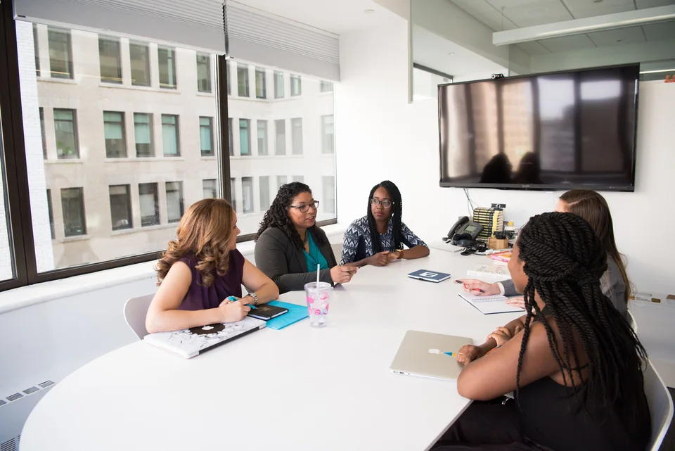 Women collaborating around a conference table